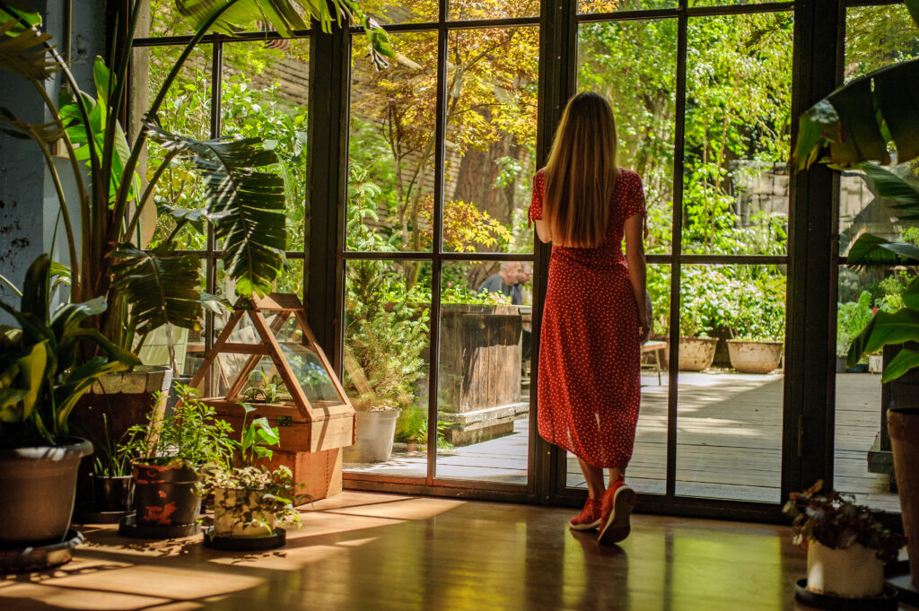 The current image has no alternative text. The file name is: girl-beautiful-red-dress-looking-window-scaled.jpg